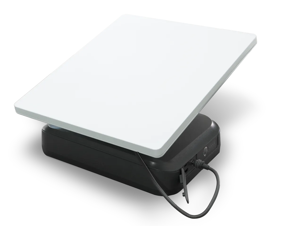 Starlink Mini dish positioned above the StarGrid portable power kit and protective case.